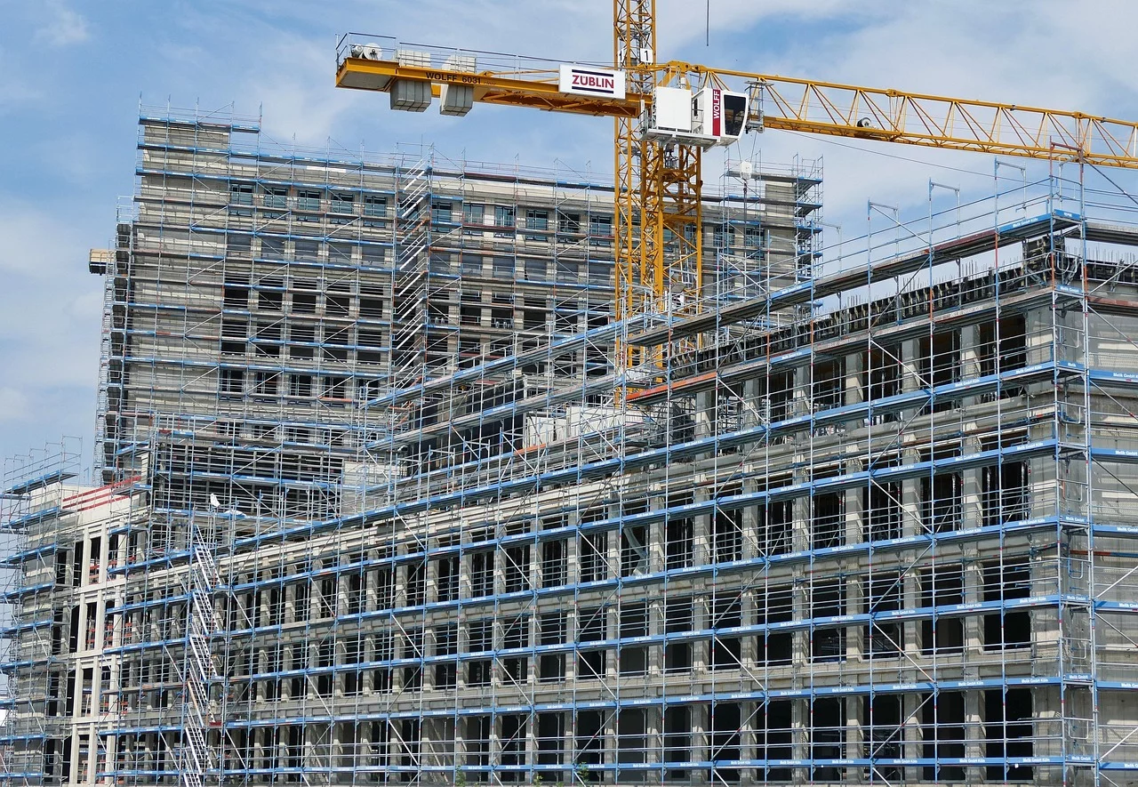 construction with crane and scaffolding