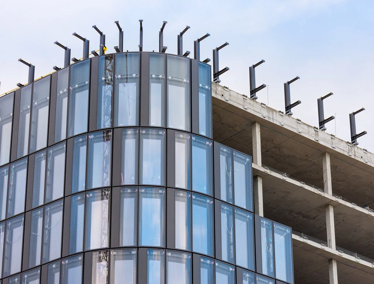 glass panels on apartment build, construction site